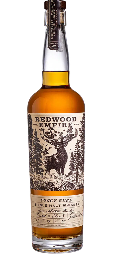 Image of Redwood Empire Whiskey Single Malt Foggy Burl 750ml bottle, part of the Small Lot Series from California. The bottle features elegant labeling with dark green and gold accents, prominently displayed against a backdrop of dense Redwood trees shrouded in mist